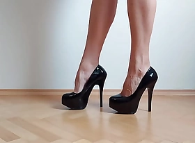 Footjob with sexy black on one's high horse heels
